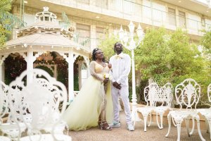 A newlywed couple in an outdoor wedding chapel
