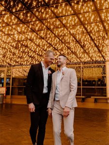 A couple sharing a moment under a lighted awning