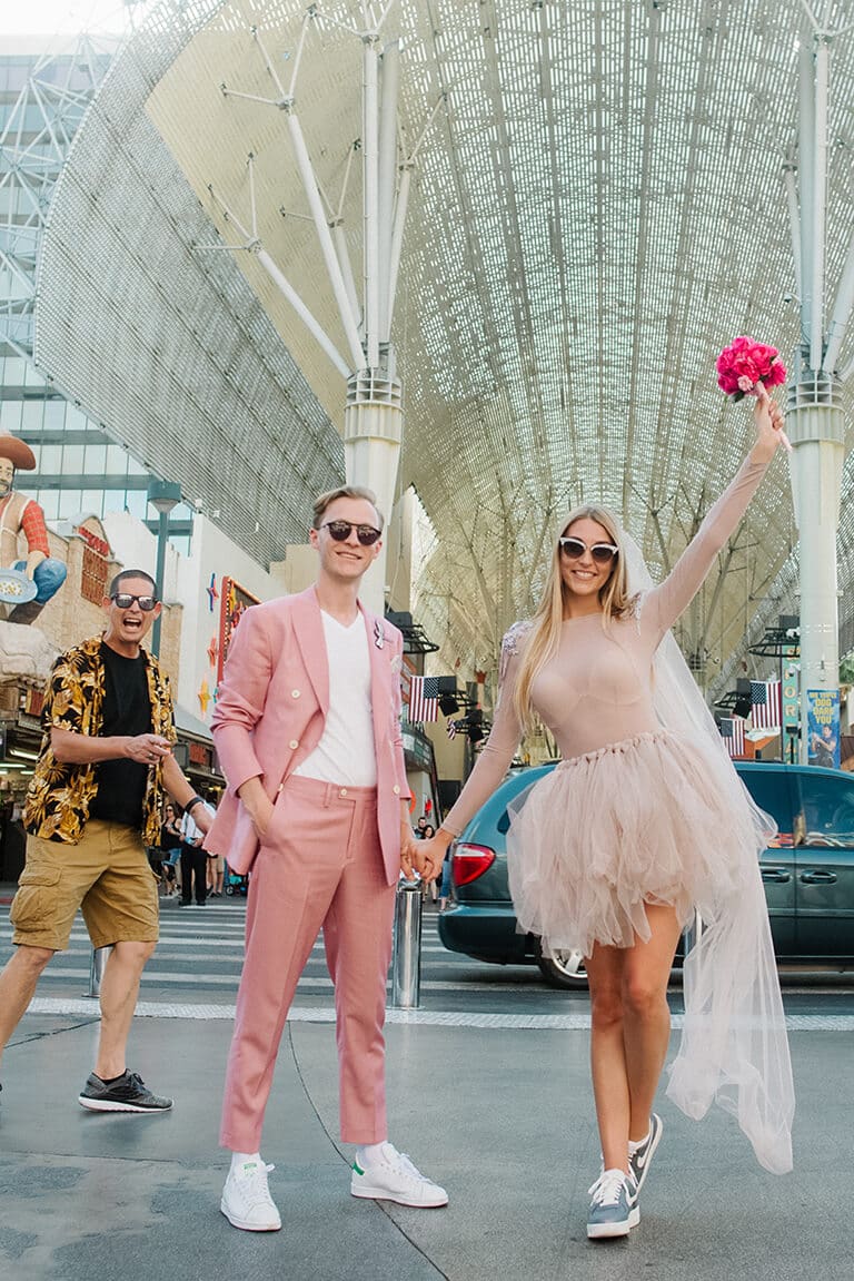 Wedding couple having fun on Fremont Street in Las Vegas
