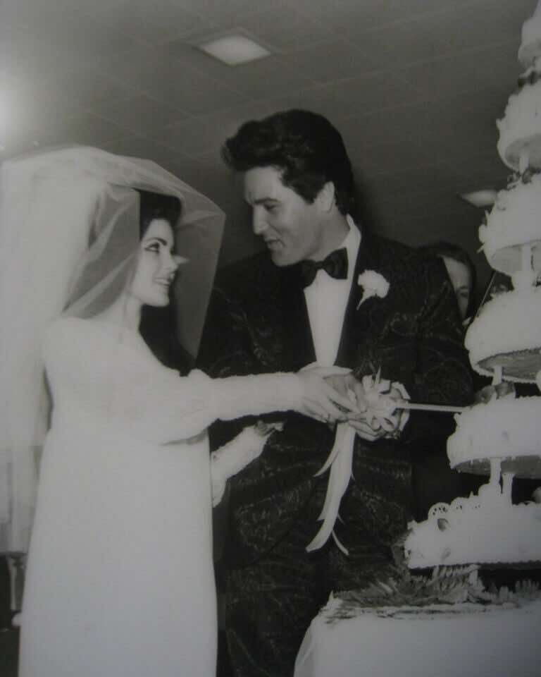 Elvis and Priscilla Presley cutting their wedding cake in Las Vegas