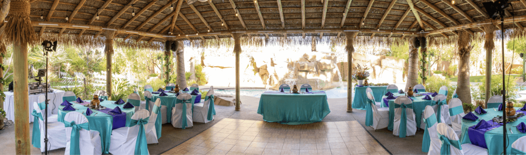 Teal tables and a tropical background about to serve Las Vegas wedding food