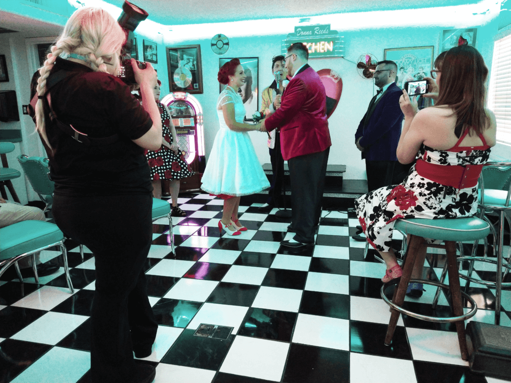 a couple getting married in a diner