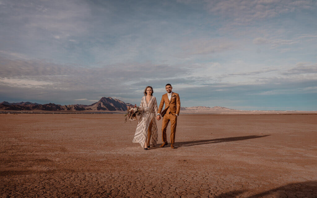 a couple walking through a desert feeling no stress