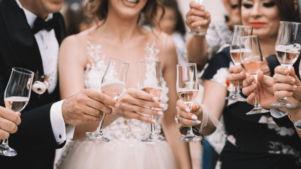 a wedding couple toasting with wine