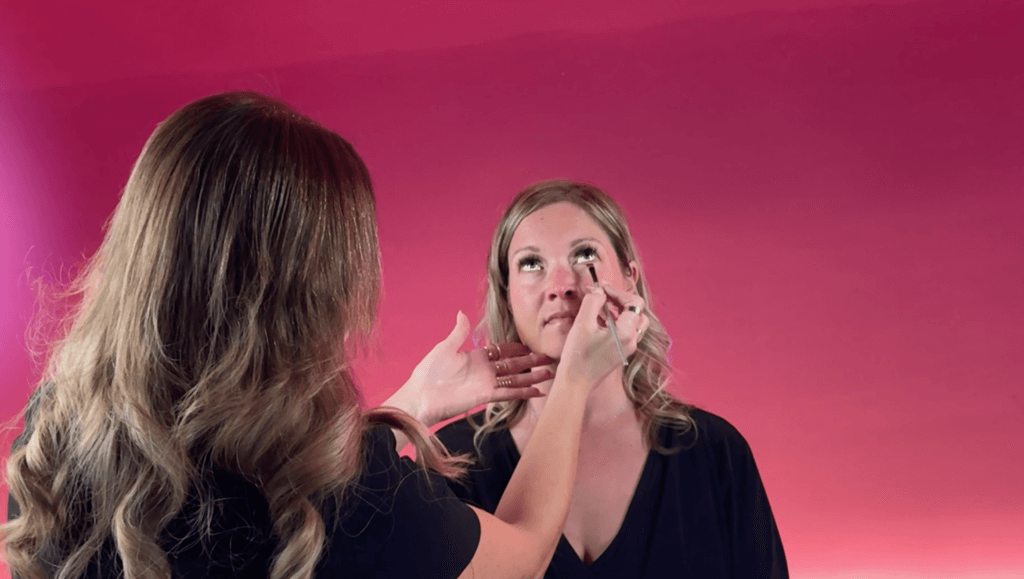 Kim Katunis working on a makeup look for a bride