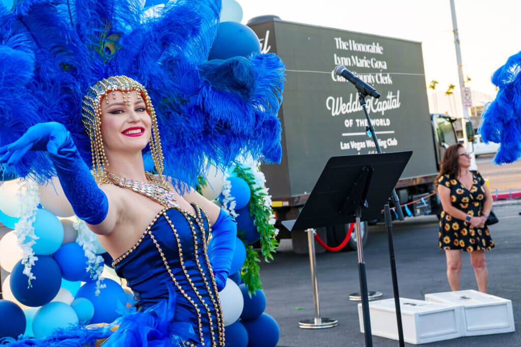 a dancer smiles and waves