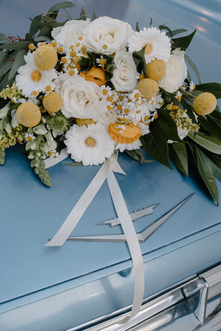 wedding flowers on a car