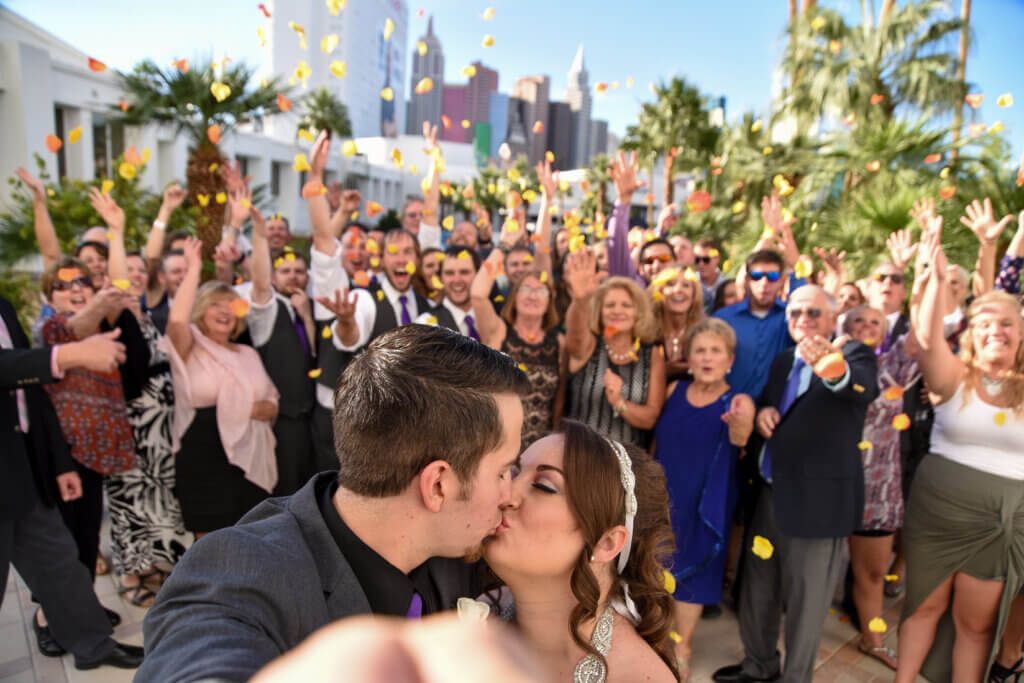 a couple kissing on wedding day