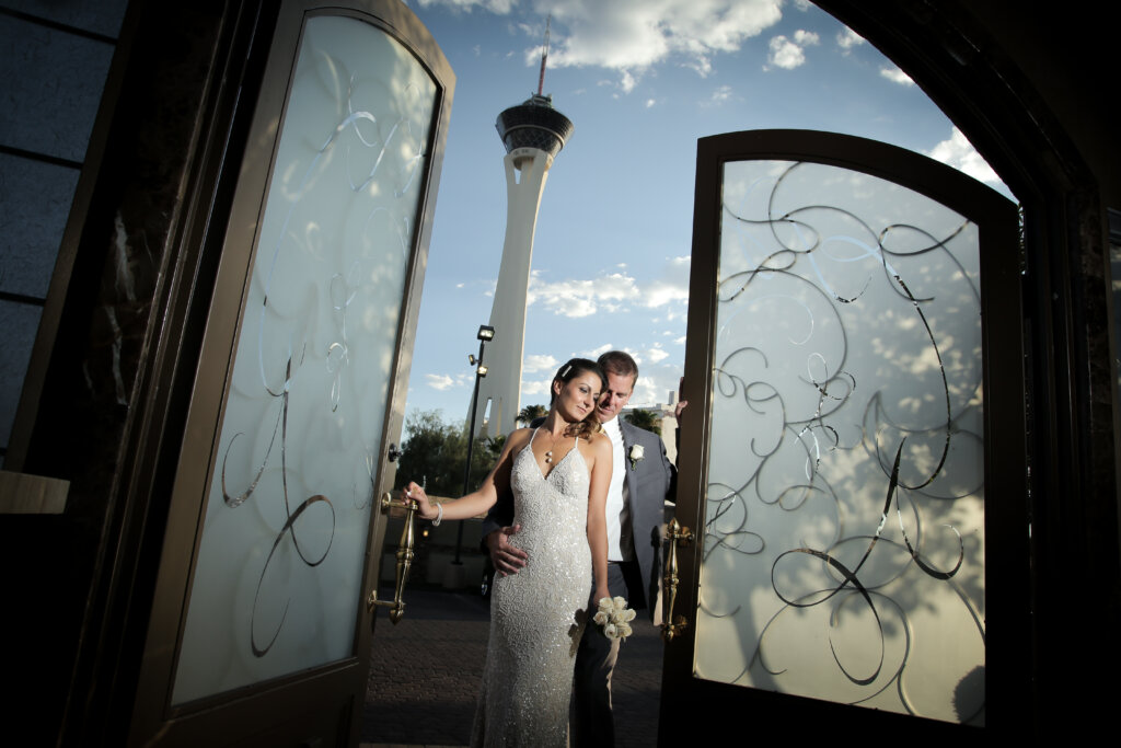 a couple standing in front of The STRAT