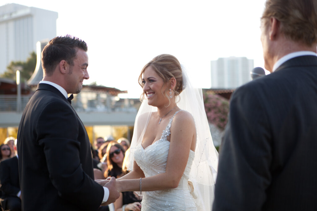 a smiling bride and her groom