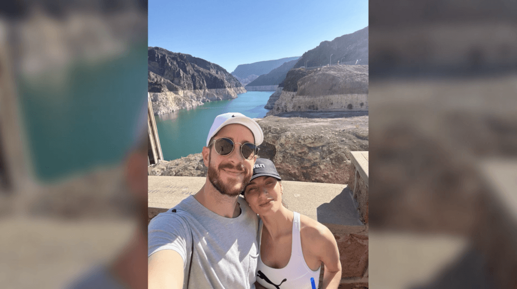 a man and a woman posing in front of Lake Mead