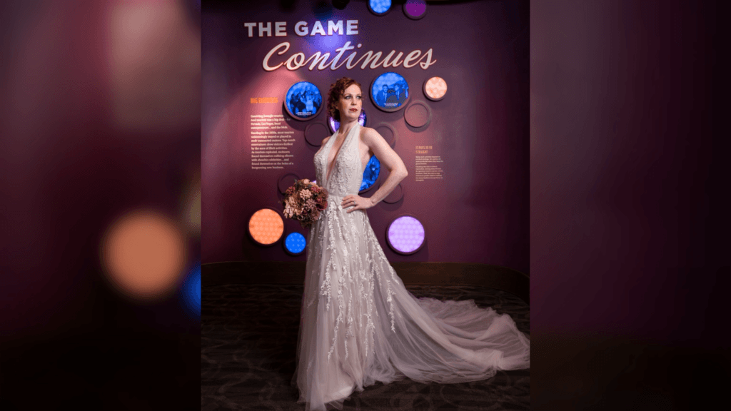 Stephanie in a wedding dress on a purple backdrop
